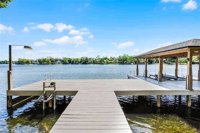 7706 Waunatta Ct, Winter Park, FL 32792 - dock area featuring a water view and boat lift