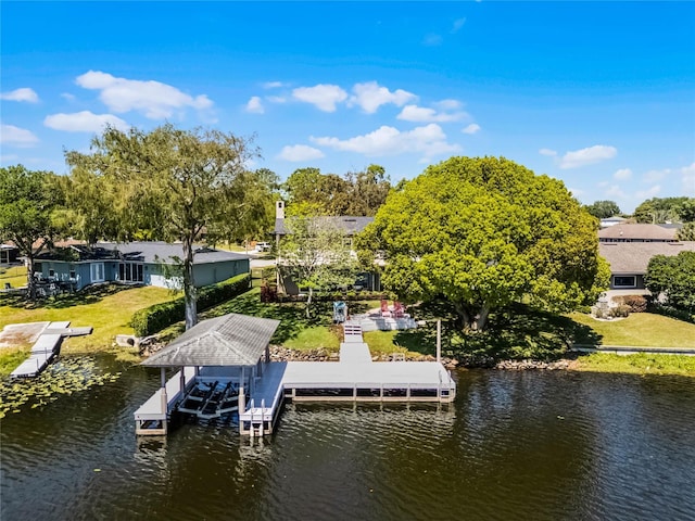 7706 Waunatta Ct, Winter Park, FL 32792 - dock area with boat lift, a water view, and a yard