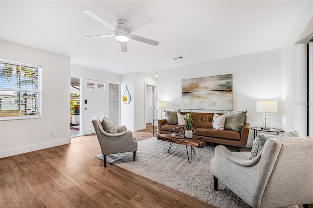 5980 32nd Ave N, Saint Petersburg, FL 33710 - living area with ceiling fan, wood finished floors, and baseboards