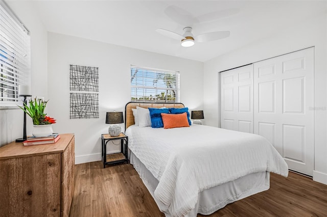5980 32nd Ave N, Saint Petersburg, FL 33710 - bedroom featuring wood finished floors, baseboards, a closet, and a ceiling fan