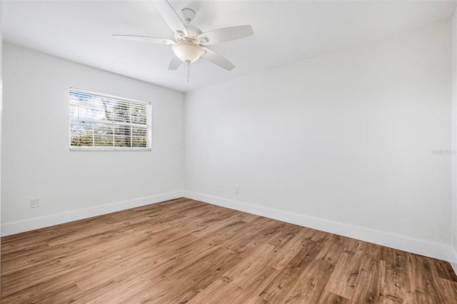 5980 32nd Ave N, Saint Petersburg, FL 33710 - spare room featuring baseboards, light wood-style flooring, and a ceiling fan