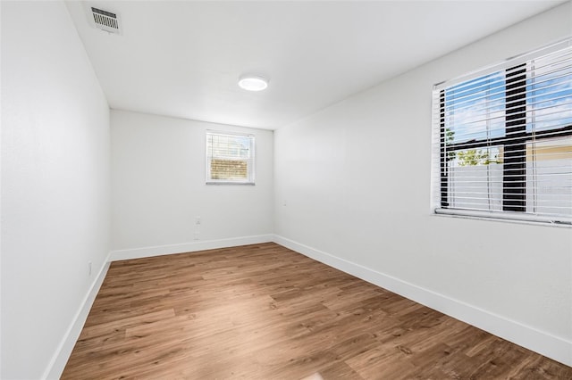 5980 32nd Ave N, Saint Petersburg, FL 33710 - unfurnished room with wood finished floors and baseboards