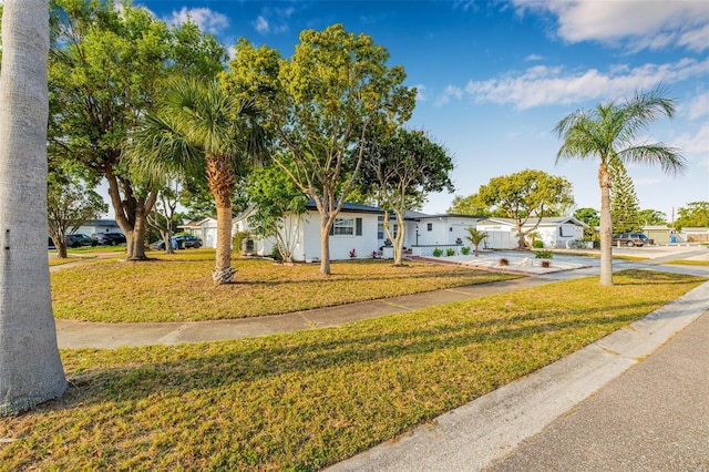 5980 32nd Ave N, Saint Petersburg, FL 33710 - view of front facade featuring a front yard