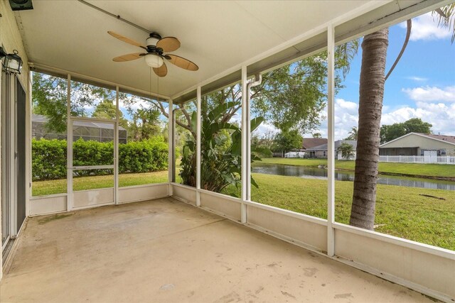 529 Tuten Trl, Orlando, FL 32828 - unfurnished sunroom featuring a water view and ceiling fan