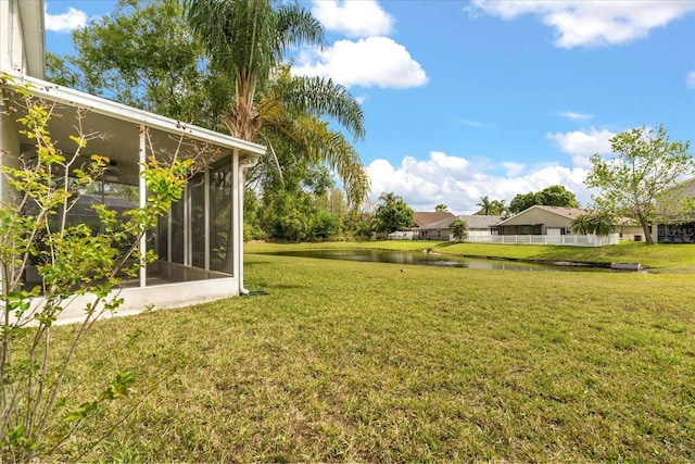 529 Tuten Trl, Orlando, FL 32828 - view of yard with a sunroom and a water view