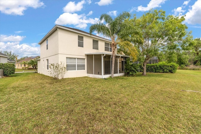 529 Tuten Trl, Orlando, FL 32828 - back of house with a yard, central air condition unit, stucco siding, and a sunroom