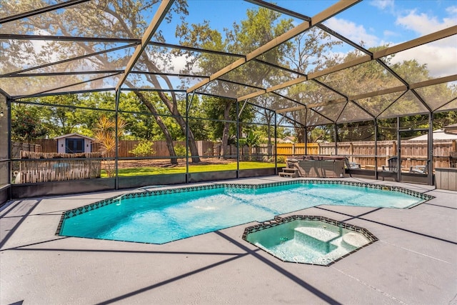 view of swimming pool featuring a covered hot tub, a patio area, and a fenced backyard