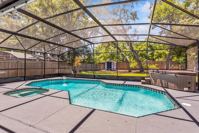 view of swimming pool featuring an in-ground hot tub, a patio, a fenced backyard, a storage shed, and an outdoor structure