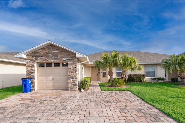 2637 Shelby Ruth Pl, Saint Cloud, FL 34769 - ranch-style house with stone siding, stucco siding, a front lawn, decorative driveway, and a garage