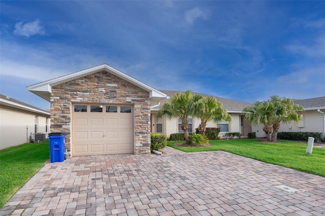 2637 Shelby Ruth Pl, Saint Cloud, FL 34769 - ranch-style house featuring a front yard, decorative driveway, an attached garage, and stucco siding