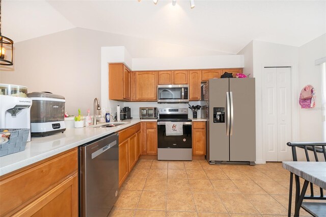 2637 Shelby Ruth Pl, Saint Cloud, FL 34769 - kitchen with light countertops, lofted ceiling, stainless steel appliances, a sink, and light tile patterned flooring