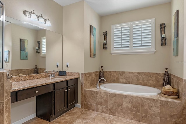 full bathroom featuring vanity and a garden tub