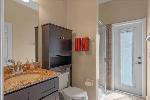 full bath with toilet, a shower stall, and vanity
