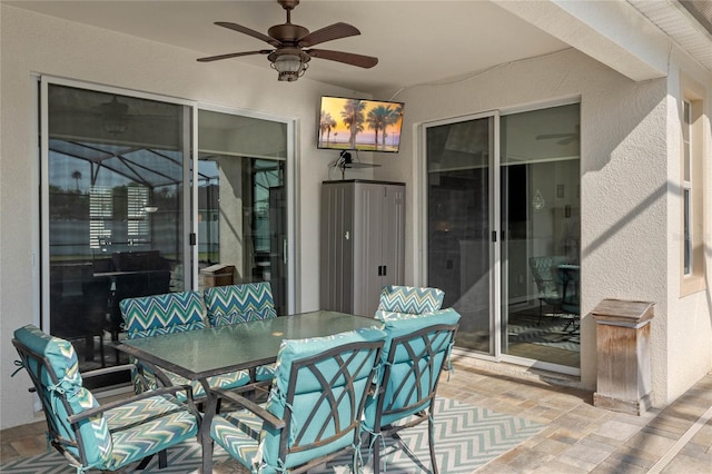 view of patio / terrace featuring a ceiling fan and outdoor dining area