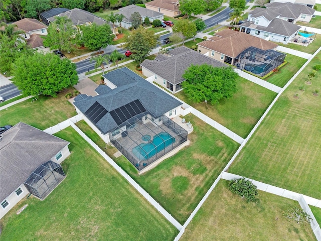 birds eye view of property with a residential view