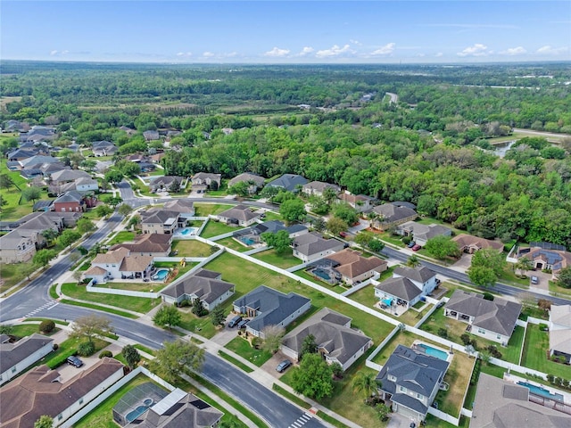 bird's eye view with a forest view and a residential view