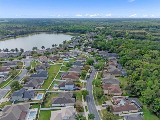 bird's eye view with a water view, a residential view, and a forest view