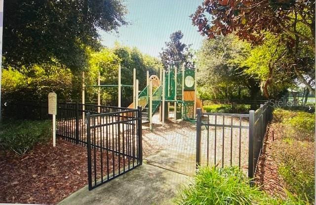 view of gate with fence