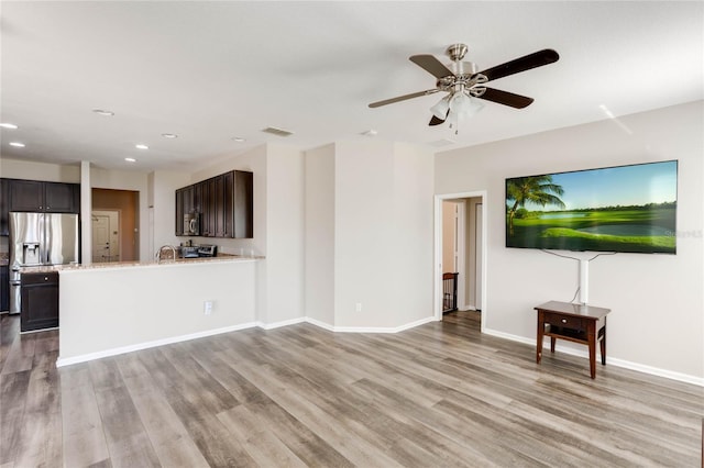 unfurnished living room featuring visible vents, baseboards, ceiling fan, recessed lighting, and light wood-style flooring