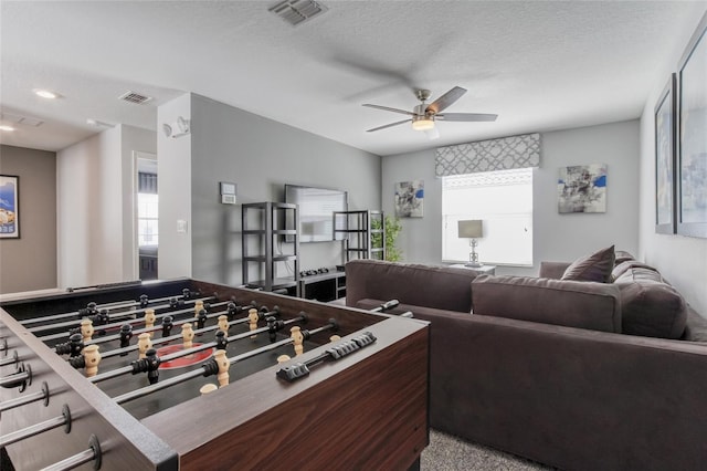 1628 Moon Valley Dr, Davenport, FL 33896 - rec room featuring a textured ceiling, visible vents, and a ceiling fan