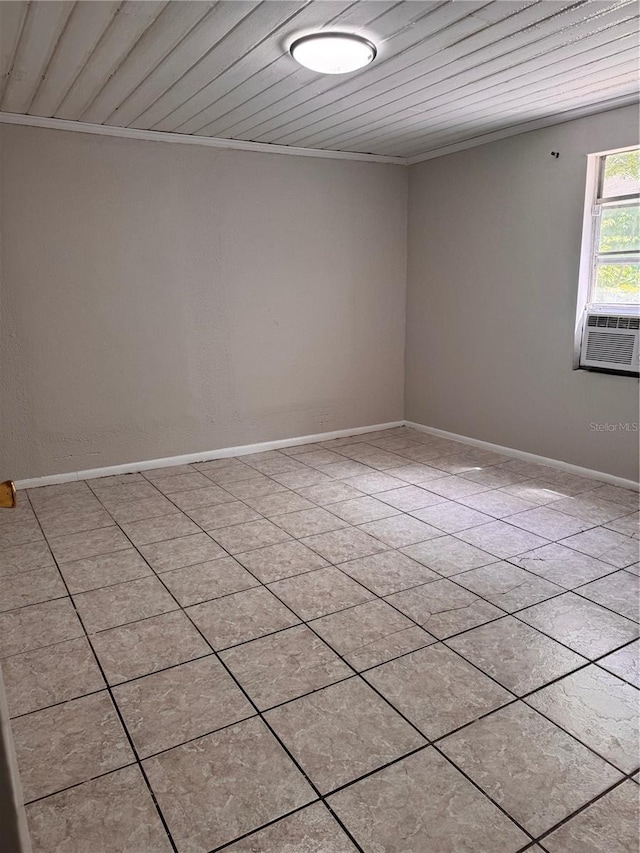 unfurnished room with baseboards, cooling unit, wood ceiling, and ornamental molding