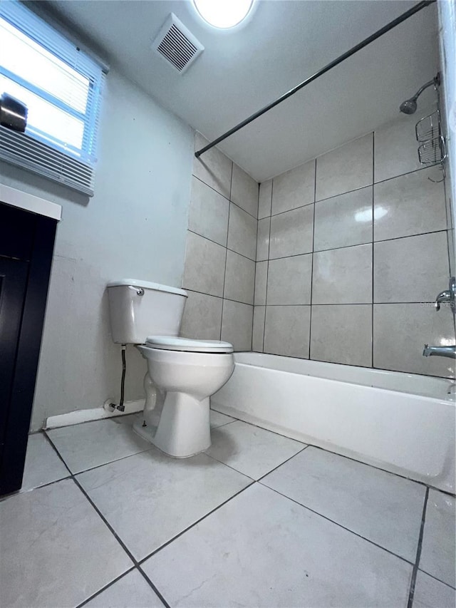 full bath with tile patterned flooring, toilet, bathing tub / shower combination, and visible vents