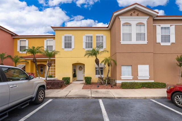 979 Park Terrace Cir, Kissimmee, FL 34746 - multi unit property featuring stucco siding and uncovered parking