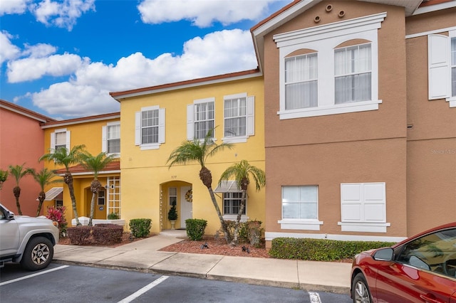 979 Park Terrace Cir, Kissimmee, FL 34746 - view of front of house with stucco siding and uncovered parking