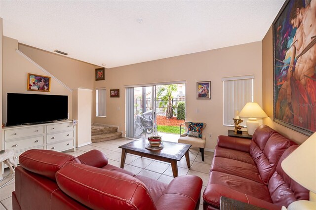 979 Park Terrace Cir, Kissimmee, FL 34746 - living area featuring light tile patterned floors, baseboards, stairs, and visible vents