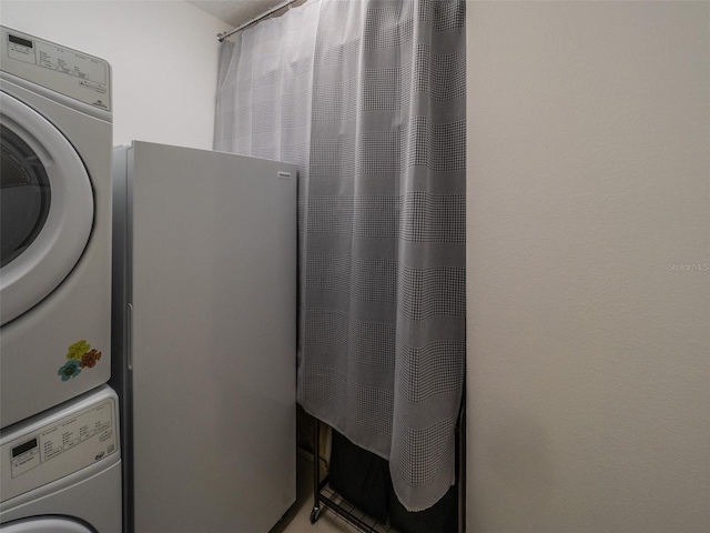 1450 Chessington Cir, Lake Mary, FL 32746 - laundry area with stacked washing machine and dryer