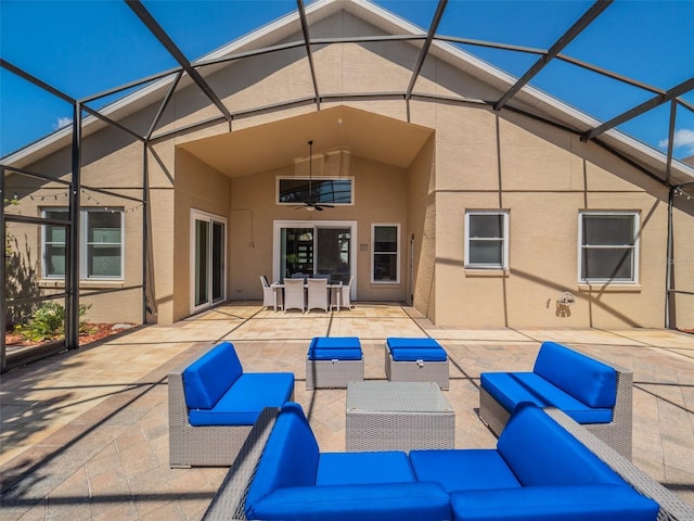 1450 Chessington Cir, Lake Mary, FL 32746 - back of house with an outdoor hangout area, stucco siding, a patio, and a lanai