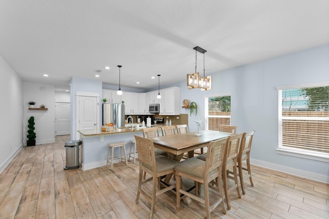 412 5th Ave S, Jacksonville Beach, FL 32250 - dining area featuring wood tiled floor, recessed lighting, and baseboards