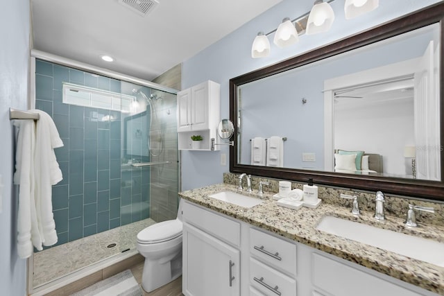 412 5th Ave S, Jacksonville Beach, FL 32250 - bathroom featuring a stall shower, double vanity, visible vents, and a sink