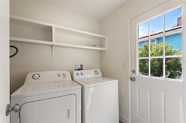 washroom featuring washing machine and clothes dryer and laundry area