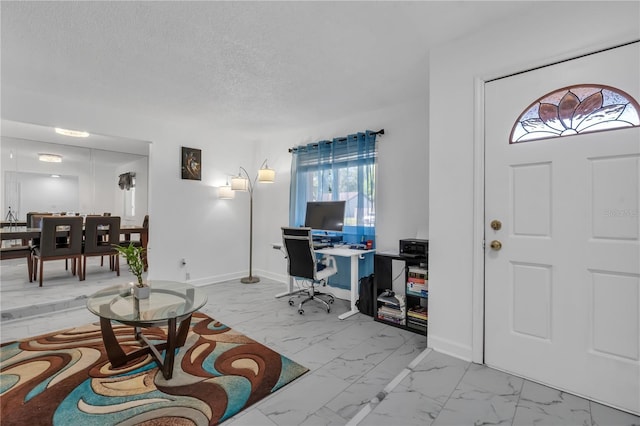 8720 Larwin Ln, Orlando, FL 32817 - foyer featuring marble finish floor, baseboards, and a textured ceiling