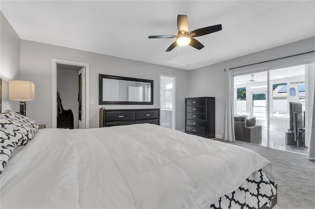 8720 Larwin Ln, Orlando, FL 32817 - carpeted bedroom featuring access to exterior, ensuite bathroom, and a ceiling fan