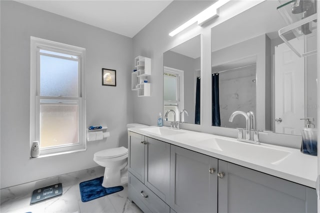 8720 Larwin Ln, Orlando, FL 32817 - full bath featuring marble finish floor, a sink, and a healthy amount of sunlight