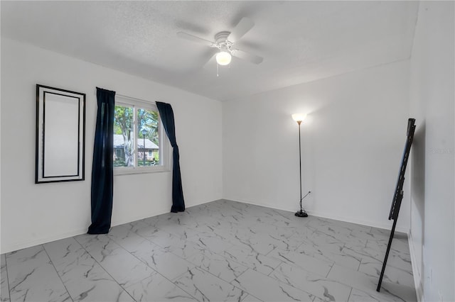 8720 Larwin Ln, Orlando, FL 32817 - unfurnished room featuring marble finish floor, a textured ceiling, baseboards, and ceiling fan