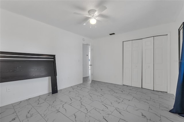 8720 Larwin Ln, Orlando, FL 32817 - unfurnished bedroom with marble finish floor, visible vents, a closet, and ceiling fan