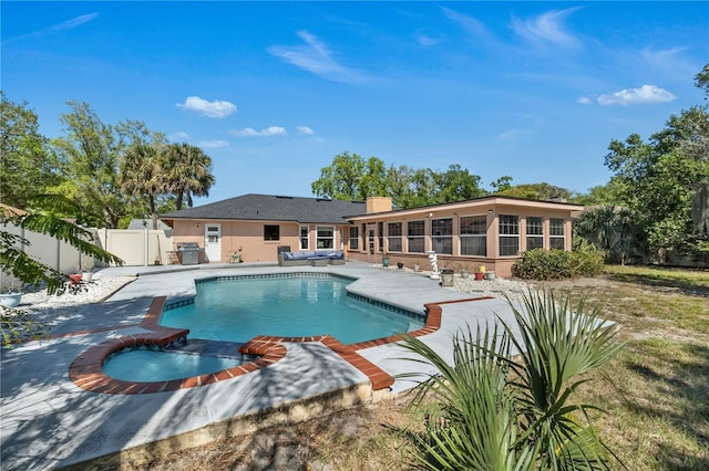 8720 Larwin Ln, Orlando, FL 32817 - view of swimming pool featuring a sunroom, a patio, a fenced in pool, a fenced backyard, and grilling area