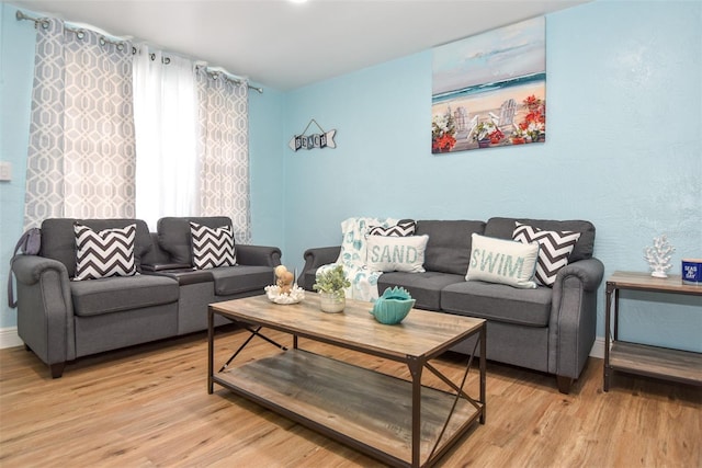 103 Mason Park Dr, Daytona Beach, FL 32117 - living room with baseboards and light wood-style floors