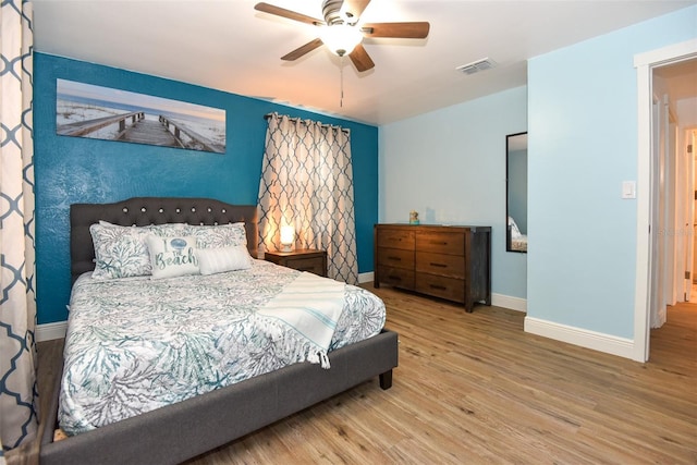103 Mason Park Dr, Daytona Beach, FL 32117 - bedroom featuring wood finished floors, ceiling fan, baseboards, and visible vents