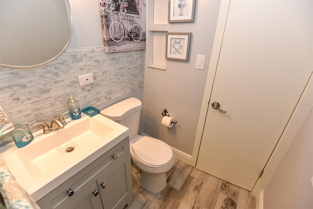 103 Mason Park Dr, Daytona Beach, FL 32117 - half bath with vanity, toilet, and wood finished floors