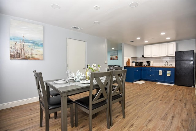 103 Mason Park Dr, Daytona Beach, FL 32117 - dining space with visible vents, baseboards, light wood-type flooring, and recessed lighting
