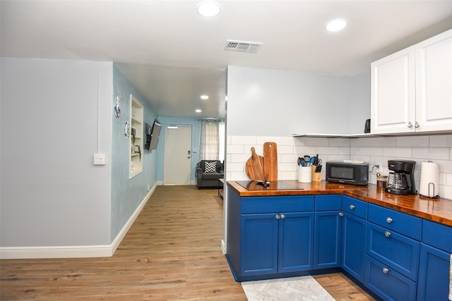 103 Mason Park Dr, Daytona Beach, FL 32117 - kitchen with wooden counters, visible vents, blue cabinets, and black appliances