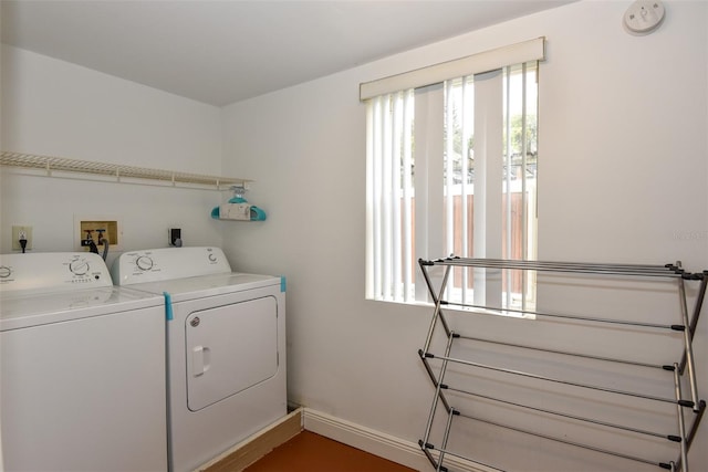 103 Mason Park Dr, Daytona Beach, FL 32117 - washroom with washing machine and dryer, laundry area, and baseboards