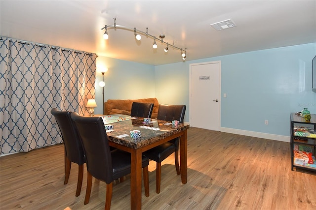 103 Mason Park Dr, Daytona Beach, FL 32117 - dining space with track lighting, visible vents, baseboards, and light wood-style flooring