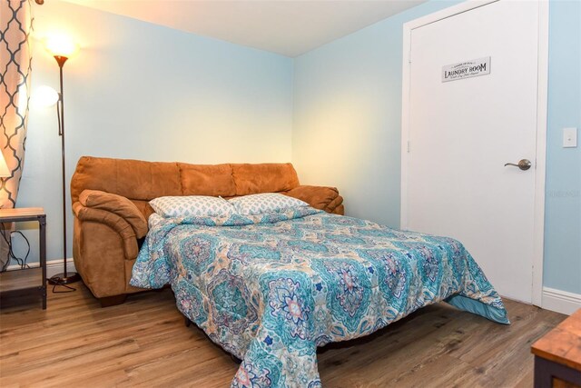 103 Mason Park Dr, Daytona Beach, FL 32117 - bedroom featuring baseboards and wood finished floors