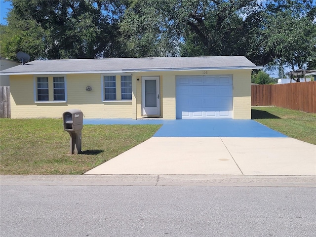 103 Mason Park Dr, Daytona Beach, FL 32117 - ranch-style home with a front yard, driveway, brick siding, and a garage
