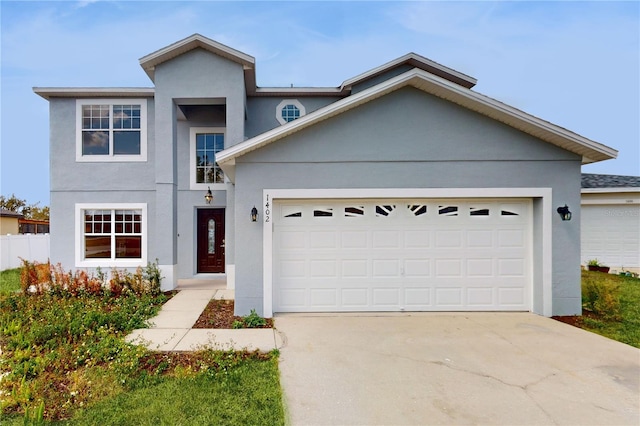 1402 Missouri Pl, Poinciana, FL 34759 - view of front of house with stucco siding, driveway, and an attached garage